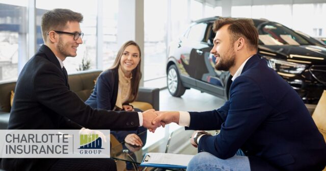 auto dealer discussing their surety bond with an insurance agent