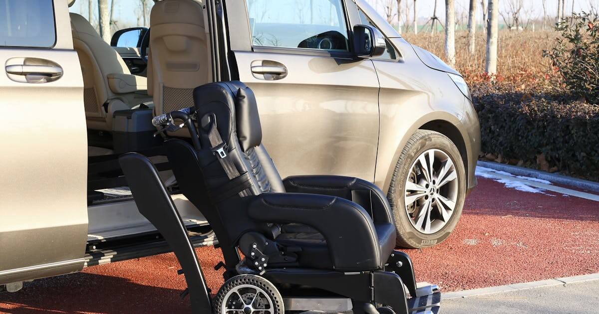 a wheelchair being loaded into a NEMT vehicle.